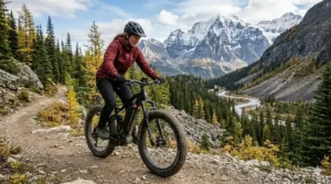 An electric fat tire bike with full suspension climbing a rocky trail in the Canadian Rockies.