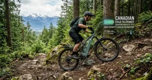 A photorealistic illustration of the best enduro ebike in a rugged British Columbia forest, with a graphic overlay highlighting its large battery capacity and superior performance in cold Canadian climates, including bilingual text for high capacity and cold tolerance.