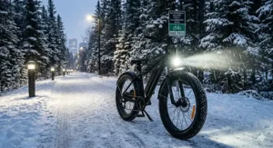 Rugged 4 season fat tire electric bike parked overlooking a turquoise glacial lake in the Rockies.