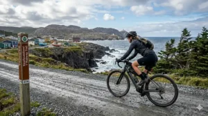 A gravel ebike navigating the rugged, coastal T'Railway section of the Trans Canada Trail in Newfoundland.