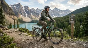 An adventurer using a hybrid ebike for city and trails at a trailhead in the Canadian Rockies.