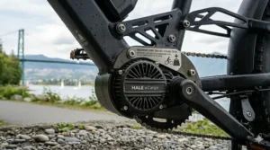 A close-up, photorealistic view of a high-torque electric bike mid-drive motor system, featuring clear gear visibility and "300 lbs capacity" branding.