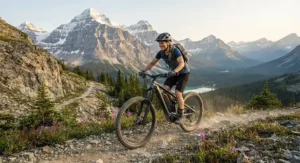 A rider enjoying a scenic trail ride through the Canadian Rockies on a dual battery electric bike.