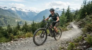 An adventurous rider testing an electric bike with a 120km range on a gravel trail in British Columbia.