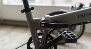 Close-up view of the sturdy locking and folding mechanism on a 20 inch folding e-bike designed for small spaces.