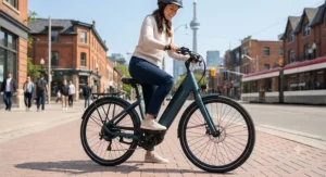 Rider easily mounting a step-through frame model of the most comfortable commuter e-bike downtown.