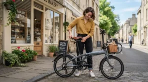 A shorter rider comfortably testing frame sizing on the best e-bike for women outside a local Canadian bike shop.