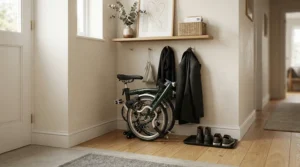 Storing a premium compact folding ebike neatly in a compact apartment hallway.